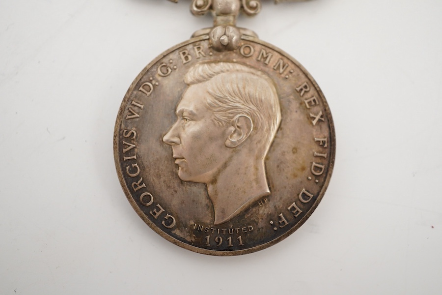 A cased George VI Rocket Apparatus Volunteer Medal Long Service Medal awarded to Harry Charles Palmer. Condition - poor to fair, hinge on the case is broken.